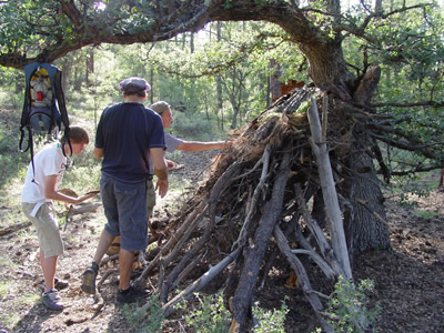 Making shelter with native materials.